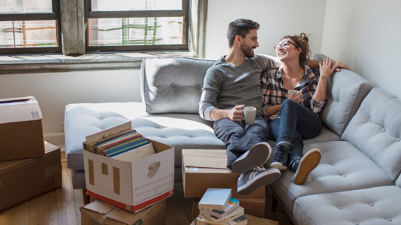 couple at home sitting on a couch