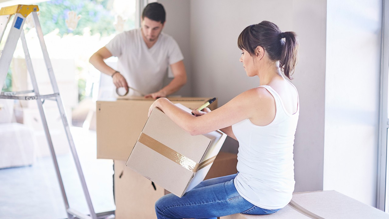 Couple moving home and packing