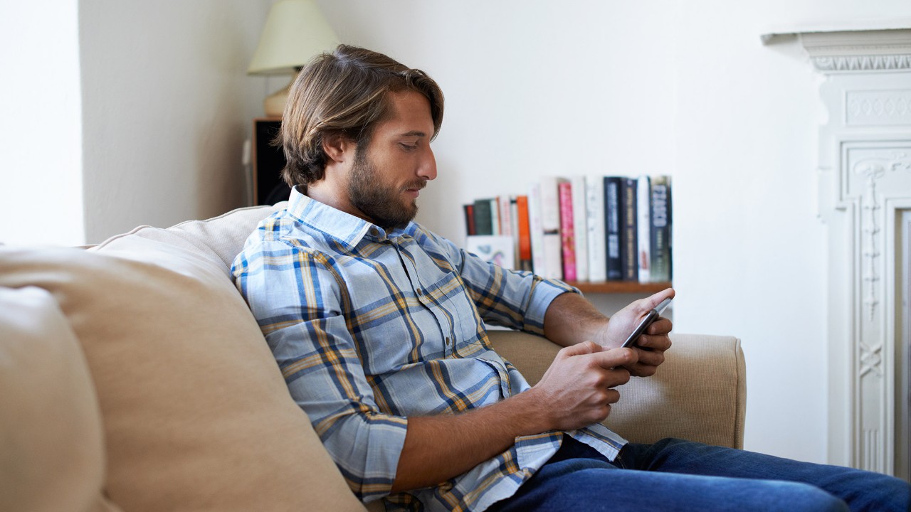 Man using tablet at home