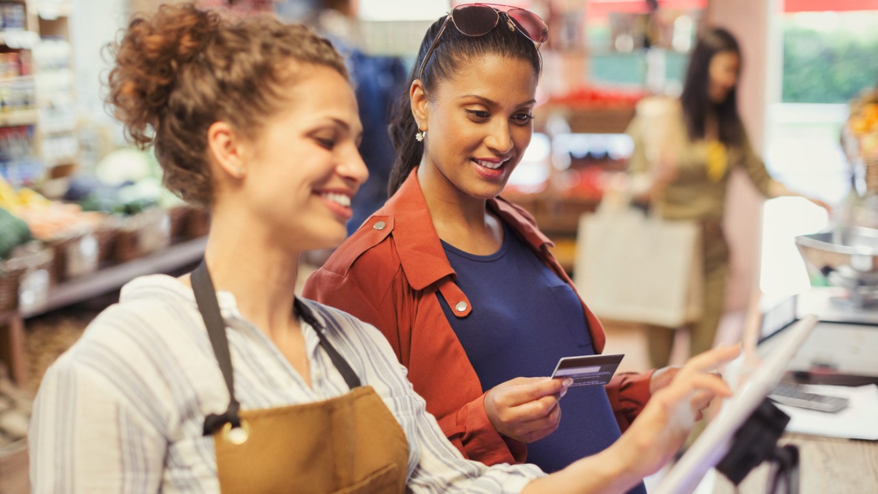 Pregnant woman using credit card