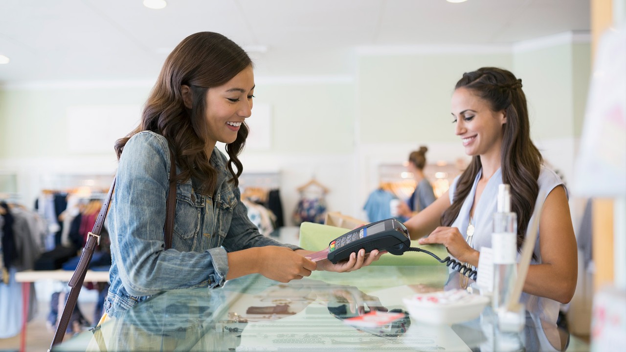 Woman paying by card