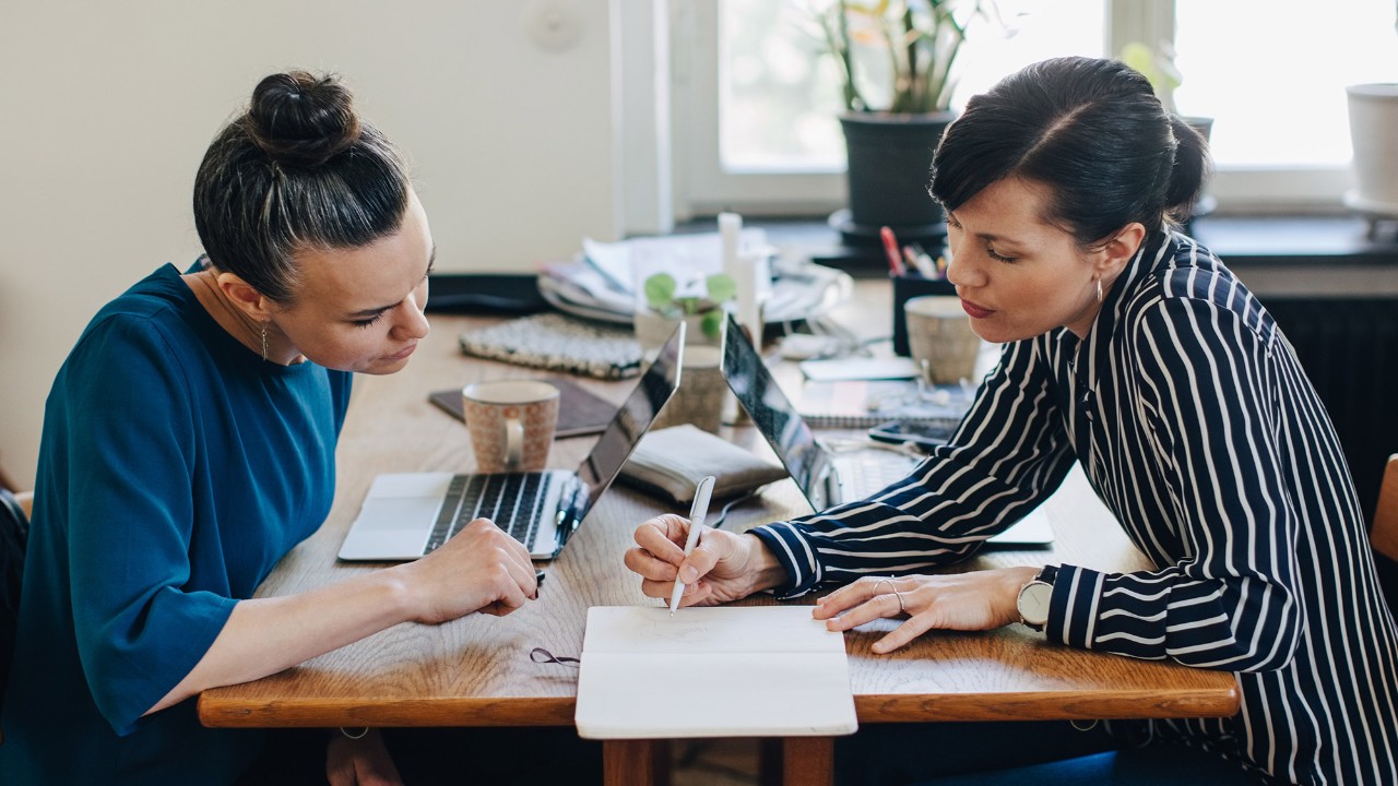 Two woman discussing in an office