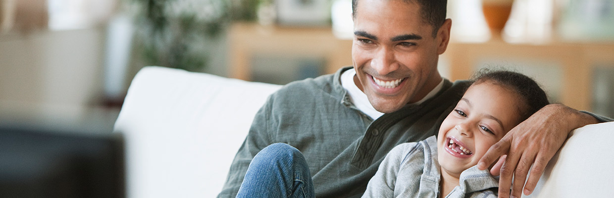 Father and daughter watching tv