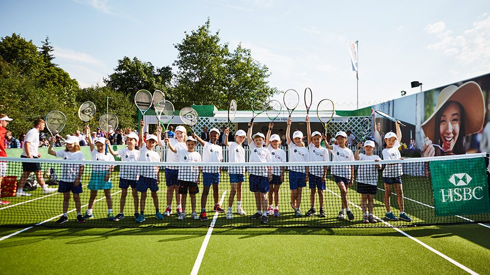 Group of kids with tennis rackets